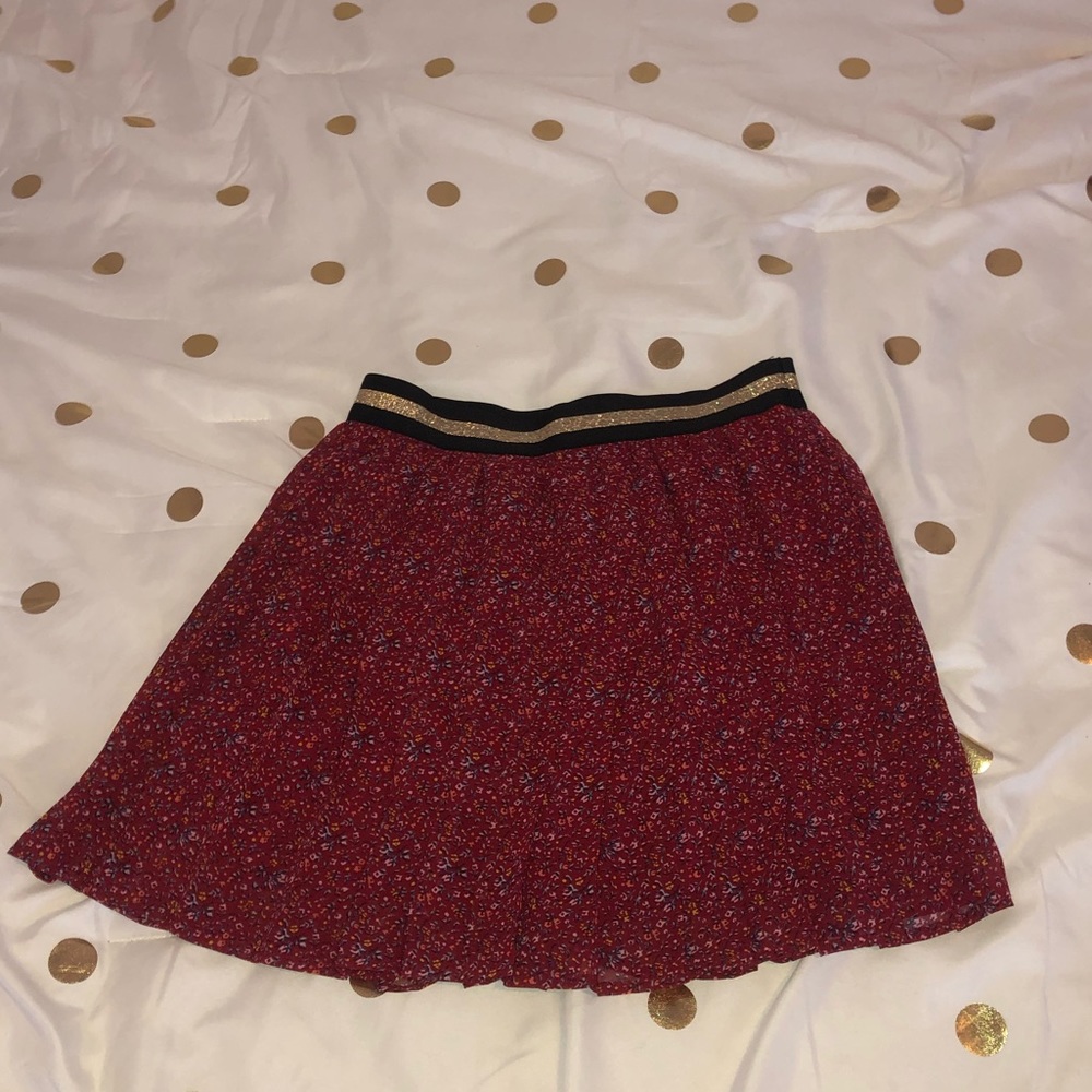 A wine colored skirt.